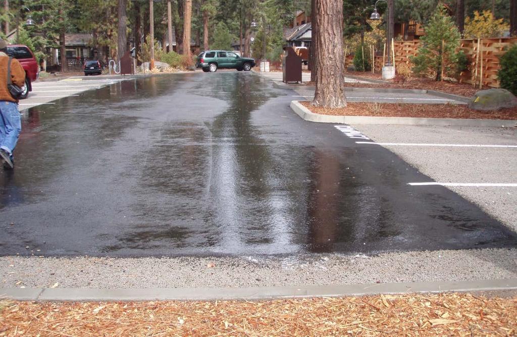 Stormwater runoff from a paved parking lot and the use of pervious pavement along the perimeter and for designated parking stalls.