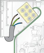 Make sure that a sufficient length of electrical supply cable is available for connection to the terminal block. Drill and plug the fixing holes.