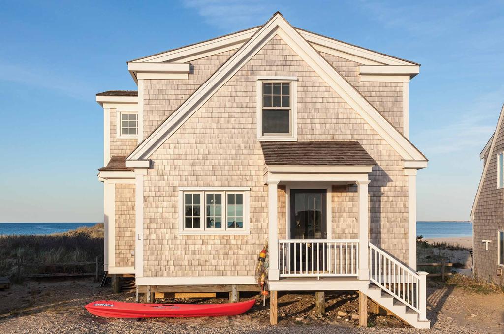 Replacing the original 500-square-foot cottage is a much more livable 1,200-square-foot summer home. The cottage rests on raised pilings to meet flood zone requirements.