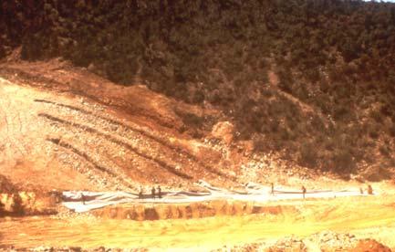VALCROS DAM, 55 ft (1970) First dam with a geotextile filter VALCROS DAM DESCRIPTION 55 ft high Homogeneous dam Silty sand, 30% < 0.