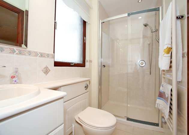 EN-SUITE Good-sized En-Suite, partially tiled and fitted with a three piece suite