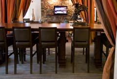 The length of the table must seat approximately 10 to 12 guests or 30% of the total seat count in new construction properties.