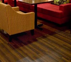 Wood look hard surface flooring occurs in the lobby and vestibule and extends past the front desk and throughout the majority of the public space on the ground floor.