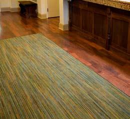 Inset carpet or area rugs of the entry vestibule should have our Make it Hampton red carpet either as a loose laid rug or inset per the Design and Construction Standards.