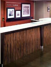 The base throughout the reception area, and where the wood look floor occurs, should be either stained wood to match the color of the floor, or a wood-like base such as Johnsonite s Millwork Vinyl