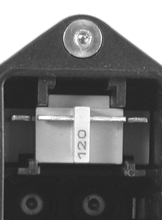 Carefully remove fuse housing to reveal Voltage Selector Insert (Figure 2c).