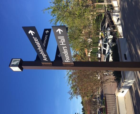 Existing directional signage limited in height and area; sign copy limited to