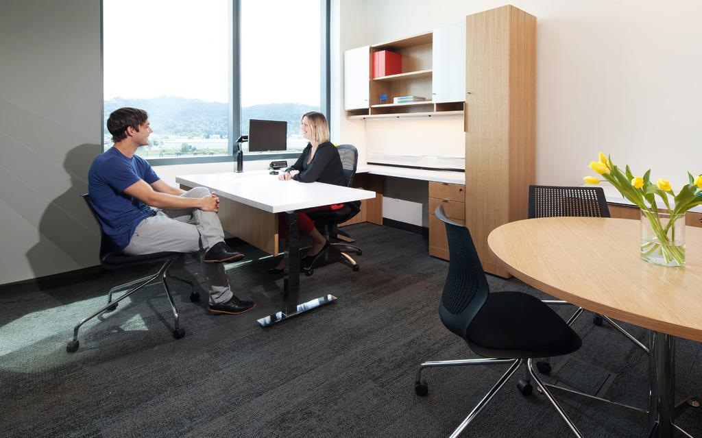 For employees who need private meeting space, MultiGeneration by Knoll Hybrid Chairs and a side table with a Reff Profiles credenza offer both