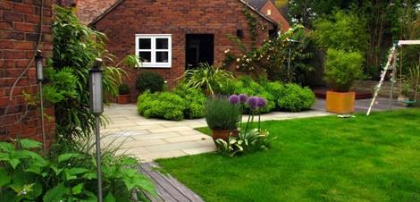 A small garden designed in a minimalist style to complement a modern three storey town house.