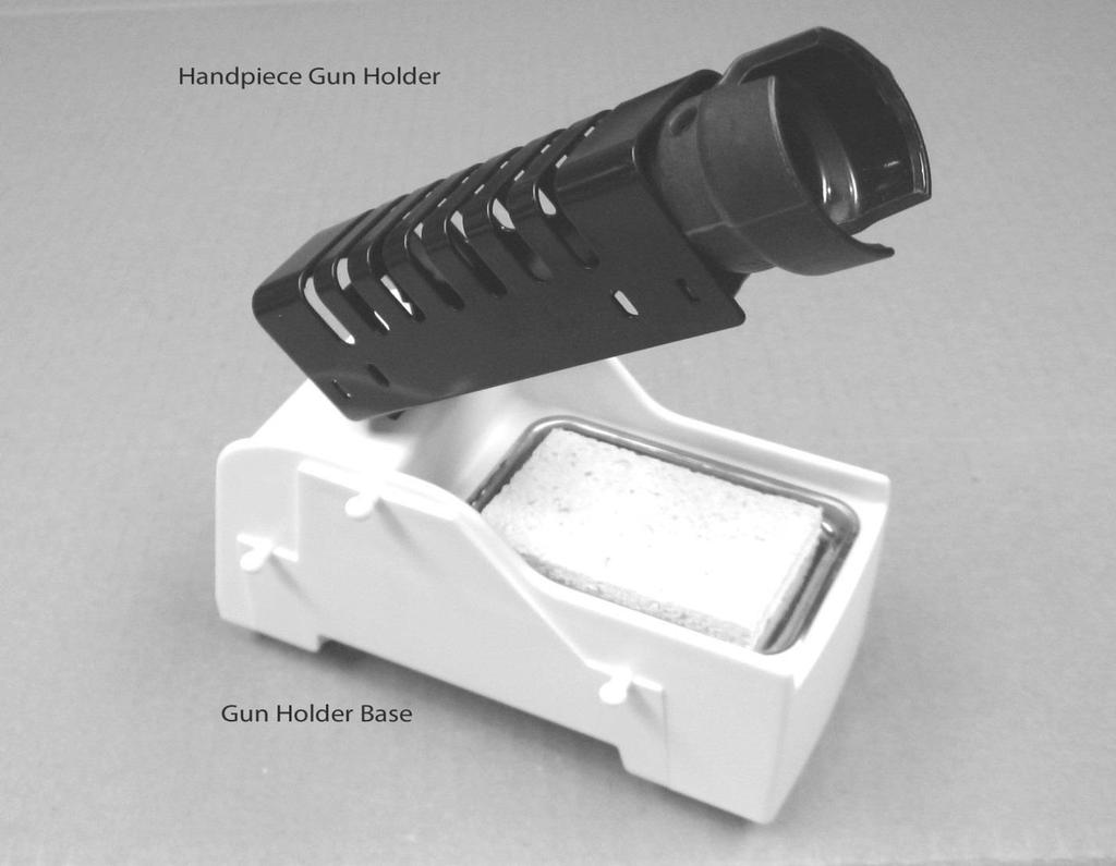 Step 2: Insert the Handpiece Gun Holder into the slot on the top of the Gun Holder Base. Note that the Gun Holder Base is able to be detached from the main unit by sliding it towards the back.