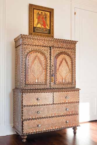 Also in the master bedroom, a Greek Orthodox icon is displayed on a keeping things quiet 19th-century Syrian cabinet.