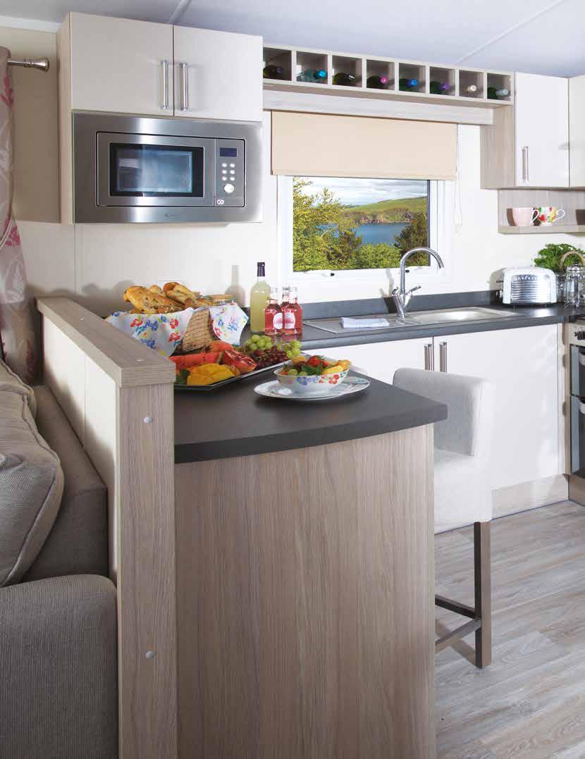Kensington 34 The kitchen layout has been designed for ease of use with everything to hand including cooker with separate grill, a large integrated fridge freezer and ample