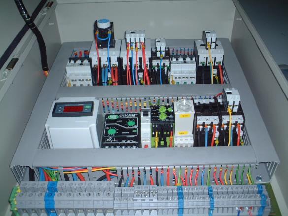 of the unit, which facilitates wiring to indoor and/or outdoor Thermostats, and Power Supply.