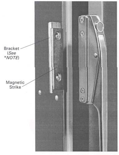 Loosen (2) screws located in magnetic strike attached to bracket on cabinet (see *NOTE). b. Move strike up or down for alignment to magnet on latch.