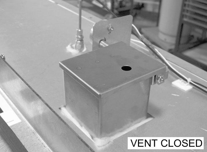 Visually check that vent opens (Fig. 11) and closes (Fig. 12) when button is pushed.