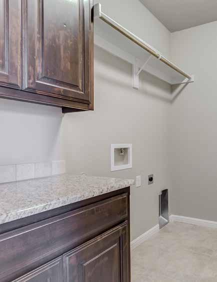5 baseboards Wood window stools Hanging rod above washer and dryer Full wood cabinetry Single crown at top