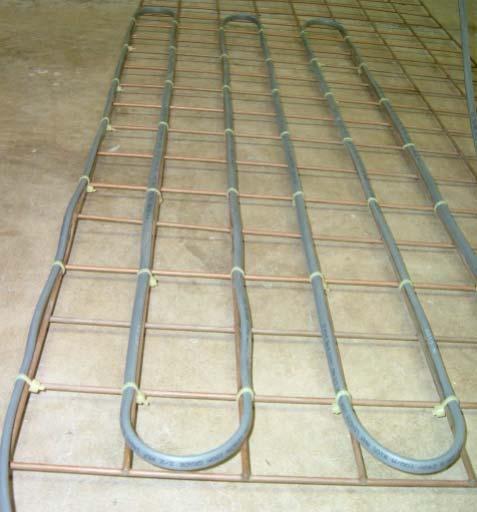 INSTALLATION Heating tape is laid in longitudinal runs either flat or on edge and secured to the reinforced mesh using cable ties at maximum 600mm intervals.
