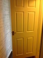 hardwood door, brass handles, clean condition.