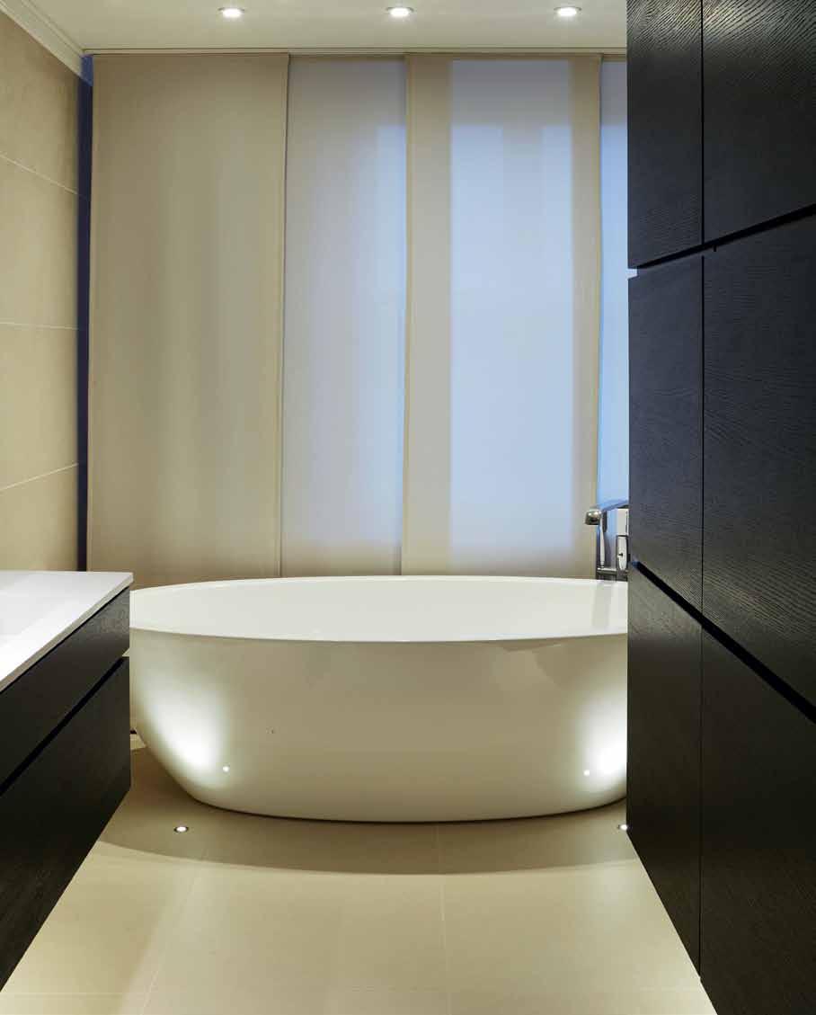 A freestanding tub replicates that hotel look We were aiming for and achieved a modern, contemporary space with rustic touches to suit the home s location Mila Podiablonska We were aiming for and