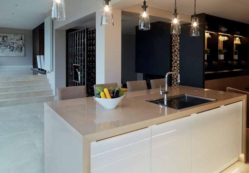 BELGIAN BEAUTY The kitchen island is lit by a row of pendant lights luxury farmhouse A humble abode is transformed into a high-end hotel at home Words Annabelle Cloros Photography Richard Gooding