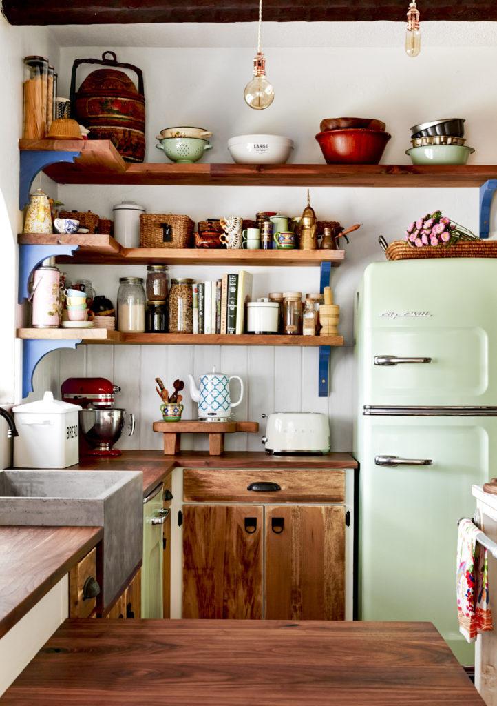 This quant little farmhouse style kitchen on a horse ranch in Florida is cozy and colorful.