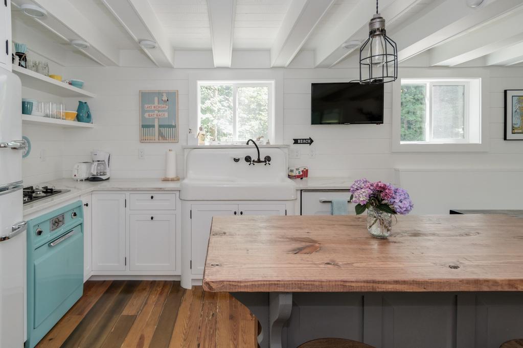 Add a vintage farmhouse sink and rustic light fixture, and