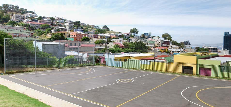 Public park with sports facilities overlooking the roofscapes of Bo Kaap Open green space Community parks and recreation School
