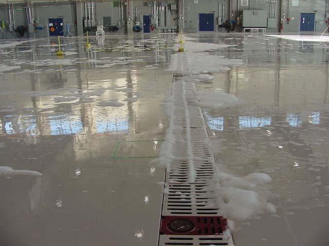Figure 11: Trench Drains in an Aircraft Hangar. The design options added in the 2001 Edition of NFPA 409 were brought forth by the U.S.