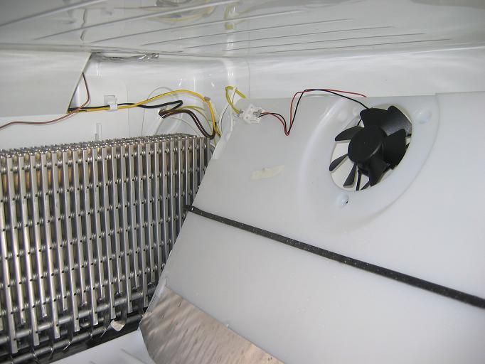 There are two wires connected to the panel assembly one is the temperature sensor which is clipped into place and slipped into a hold protruding through to the freezer section, and there is a plug