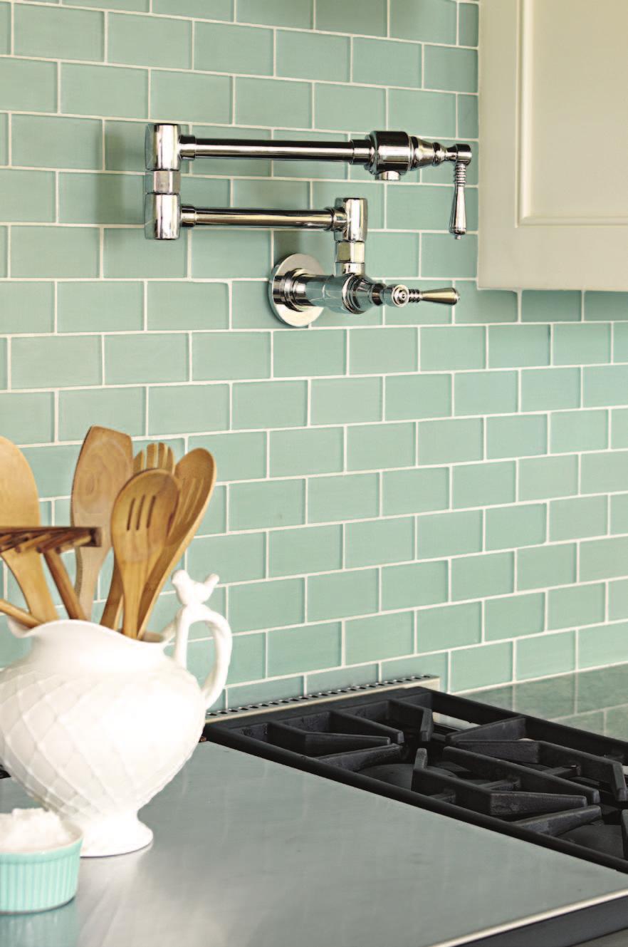 a backsplash with a shell pattern. Sea green and aquamarine the primary colors of the outside landscape inspired the kitchen palette.