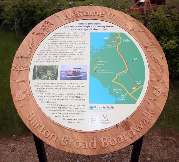 This trail head sign from Barton Broad Boardwalk uses a variety of innovative designs including raised illustrations on the sand-blasted wood frame.