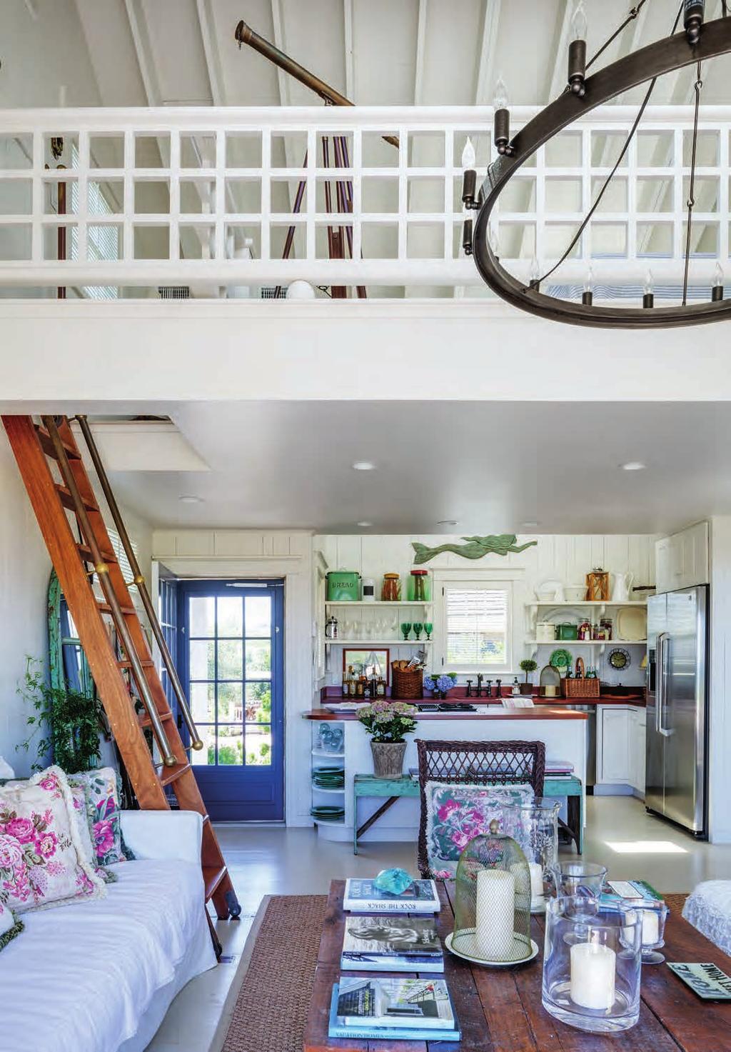 The cottage s main living space ascends by ladder to a rehabbed loft with an additional bed and a skylight that looks out to the stars.