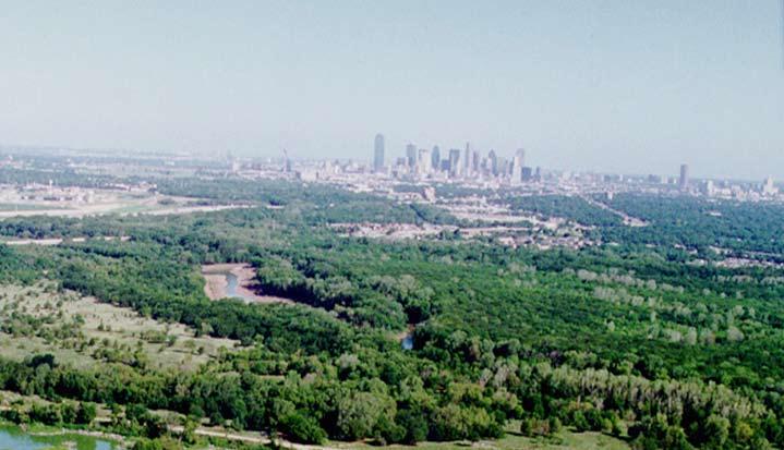 IMPLEMENTATION PLAN FOR THE TRINITY RIVER CORRIDOR The Trinity River Corridor, offering Dallas areas of natural beauty and untapped potential, runs through the heart of the city.