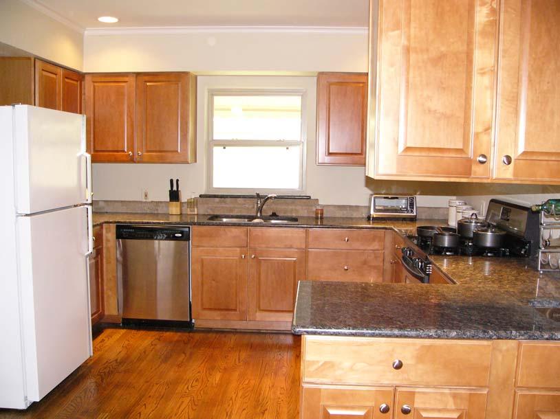 New maple cabinets with full overlay doors were installed, along with stainless steel appliances and granite
