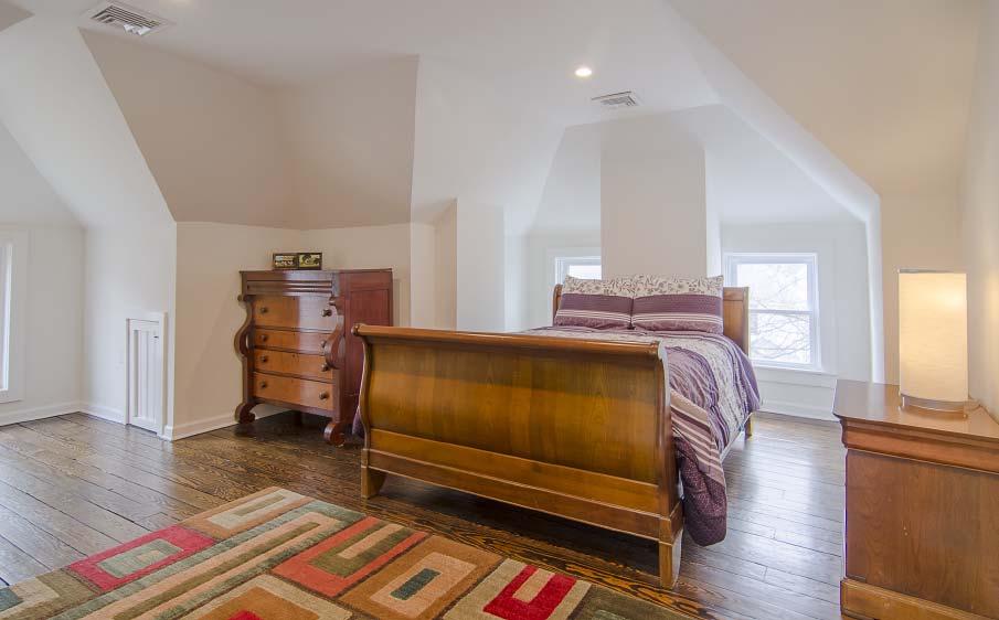 The foyer and bedrooms all include diagonal hardwood floors with
