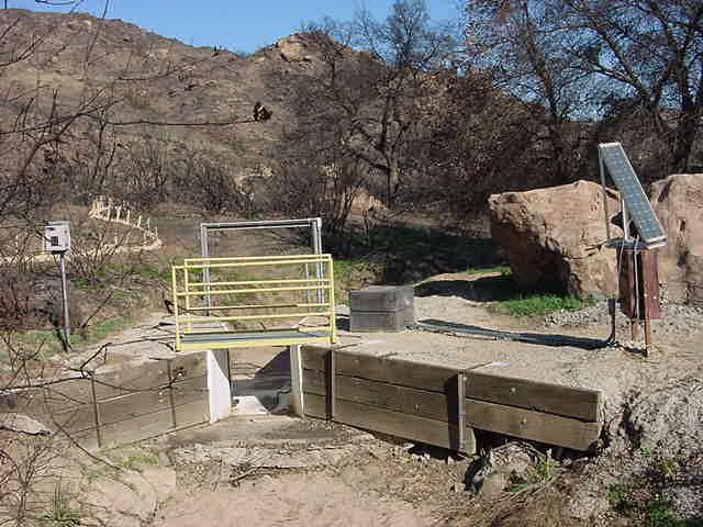 Outfall 001 (Southeast) 2 Months after 2005 Fire BMPs Implemented Straw wattles installed along burned areas of drainage.