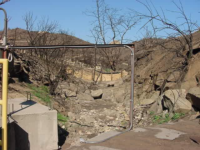 Outfall 002 (Southwest) 2 Months after 2005 Fire BMPs Implemented Straw wattles installed along burned areas of drainage.