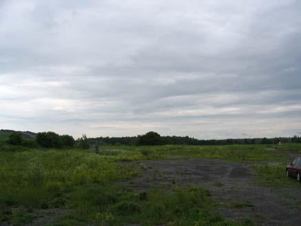 Low rise at left of photo. Similar to landscape west of road.