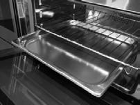 2. Drip tray The metal drip tray can only be used for toasting, browning and grilling. The drip tray can be slid into its location underneath the shelf to collect the juices from grilling (figure 4).