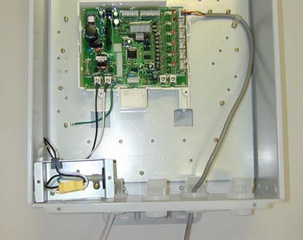 6. Connect the communication cable (MIC-K) from the water heater to the connector socket on the right side of the main communication PCB as shown in figure 9. 7.