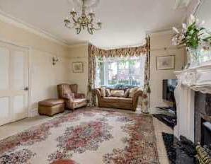Stairs to first floor with mahogany banister rail and spindles. Archway with decorative finials. Understairs storage. Built in fuse box. Smoke detector. Central heating thermostat.