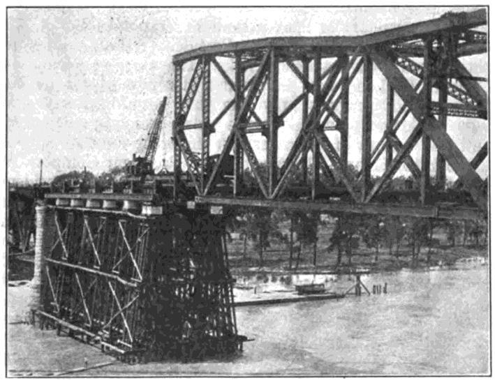 railroad bridge. Typically railroad companies are, to put it mildly, hesitant to allow civilians anywhere near their trains, let alone share a bridge with them.