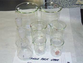 The appearance of the glassware was documented before and after washing and drying in the FlaskScrubber Laboratory Glassware Washer 10-359-115.