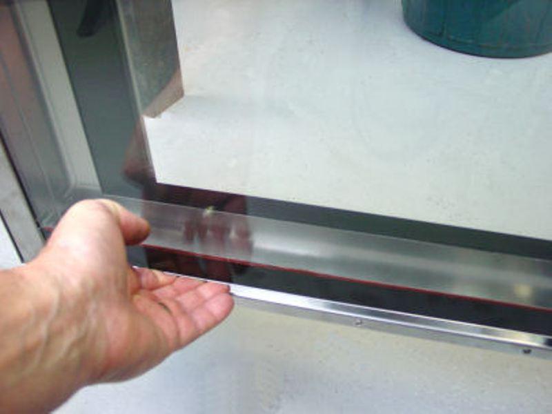 c. Wash the door seal in a sink, taking care not to cut or damage the seal. d. Dry the door seal thoroughly. e. Refit the door seal with lip facing into centre of the oven.