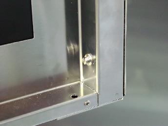 Whilst supporting door, unscrew and remove top door pivot bolt from top door hinge assembly. 7.