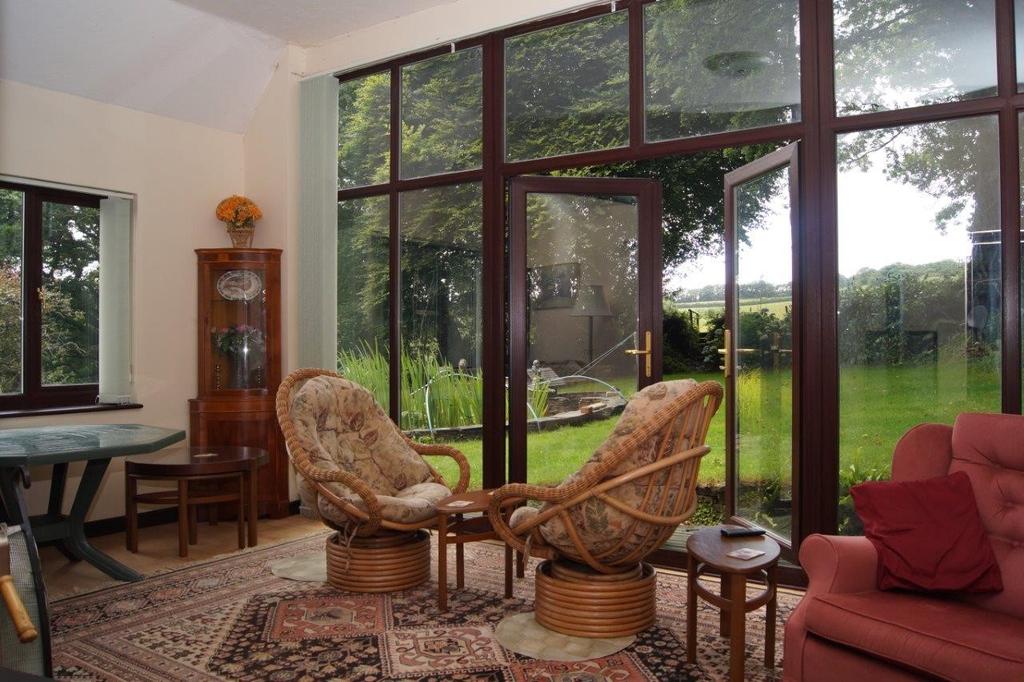 86m) Double glazed window; low level wc; shower cubicle; hot water cylinder. GARDEN ROOM 19' 5" x 12' 5" (5.92m x 3.78m) Double glazed French doors and windows to garden and views; wood burning stove.