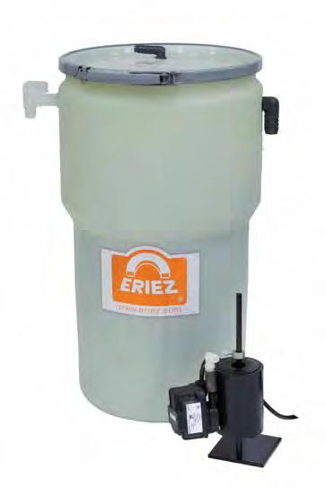 The settling tank consists of a 15-gallon polyethylene drum, an inner oil diversion baffle, an oil discharge spigot, and a clean coolant discharge hose.