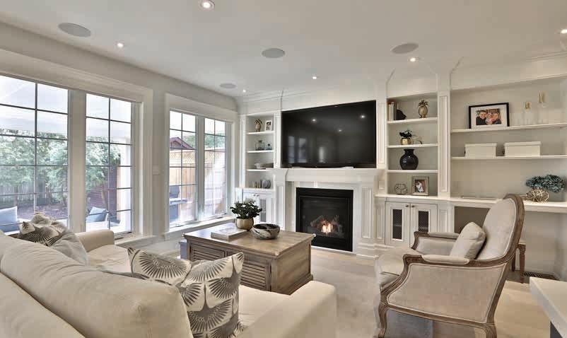 MAIN FLOOR Family Room Gas fireplace with remote control Crown moulding Custom built-in cabinetry with hidden HDMI cables