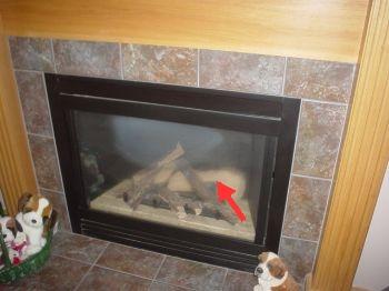 9. Fireplace Materials: Living Room Materials: prefabricated gas only visible soot like material was noted on glass.