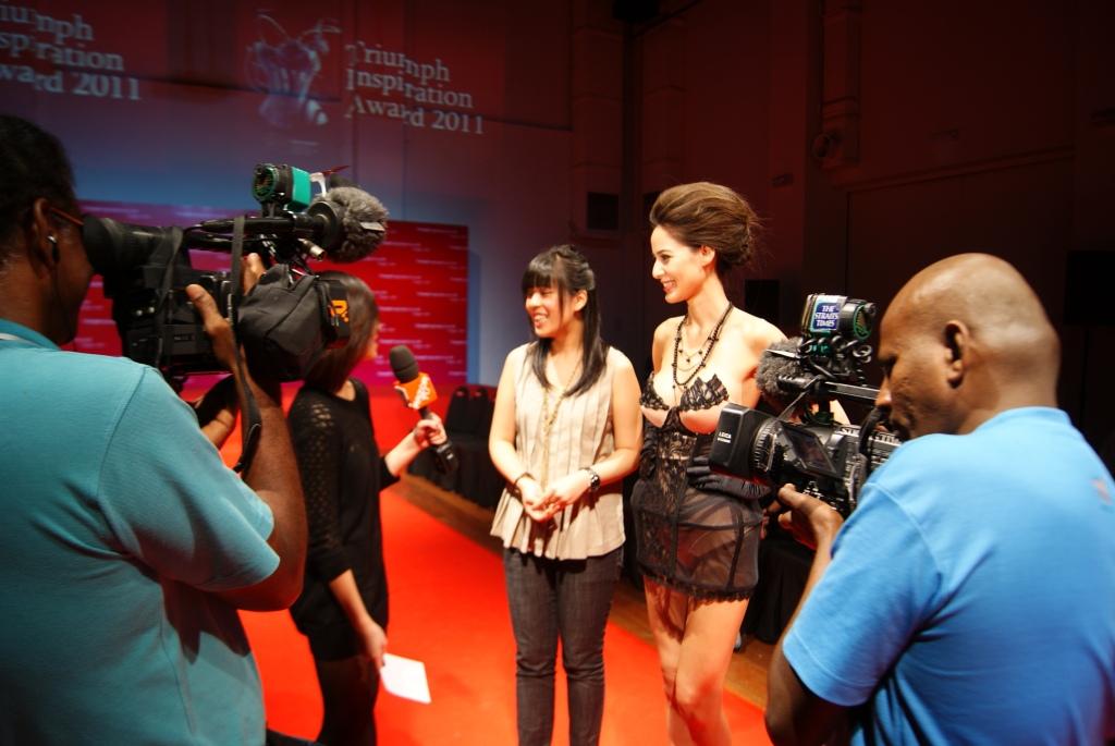 Raffles Fashion Design student, Winnie Seito (middle) giving an interview to RazorTV